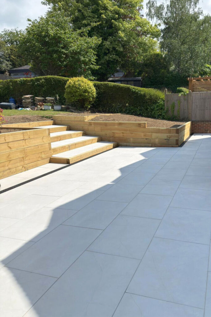 Armani White Porcelain Patio by Brick By Brick Construction & Landscape