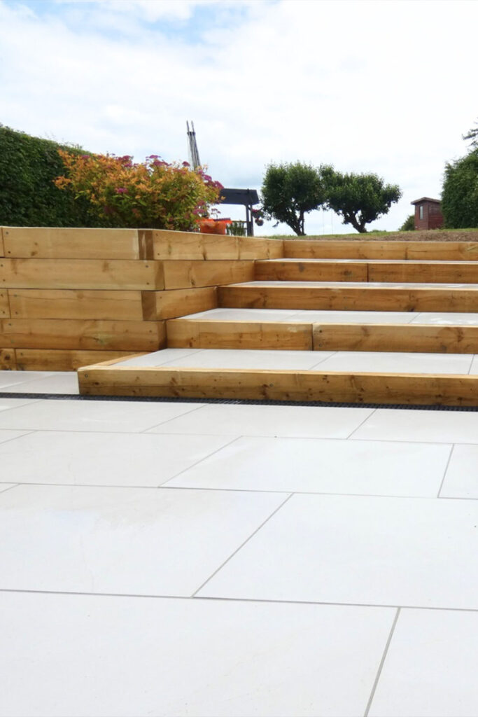 Armani White Porcelain Patio by Brick By Brick Construction & Landscape