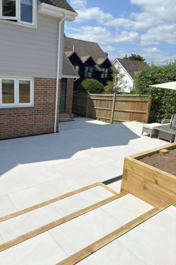 Armani White Porcelain Patio by Brick By Brick Construction & Landscape