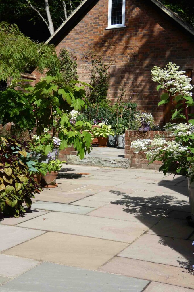 Indian Sandstone Patio in Ivy Hatch by Brick by Brick Construction & Landscape