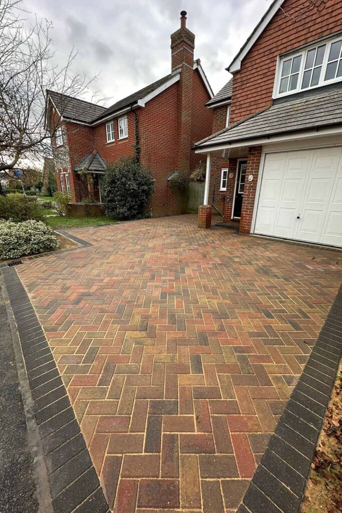 Autumn Mix Herringbone Block Paved Driveway with Charcoal border by Brick by brick construction & Landscape